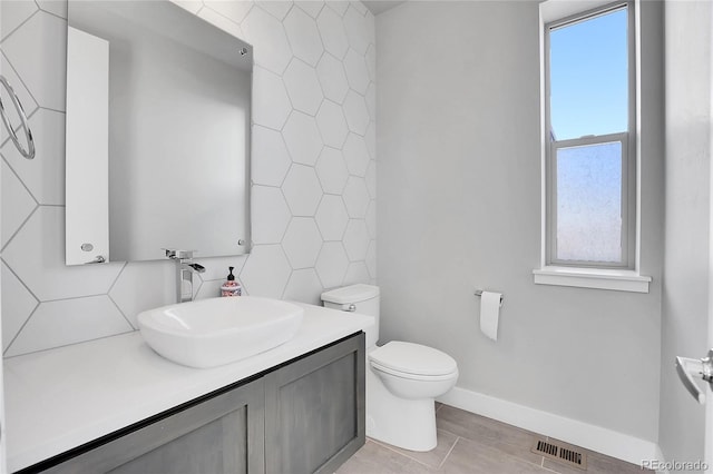 bathroom featuring hardwood / wood-style flooring, vanity, tile walls, and toilet