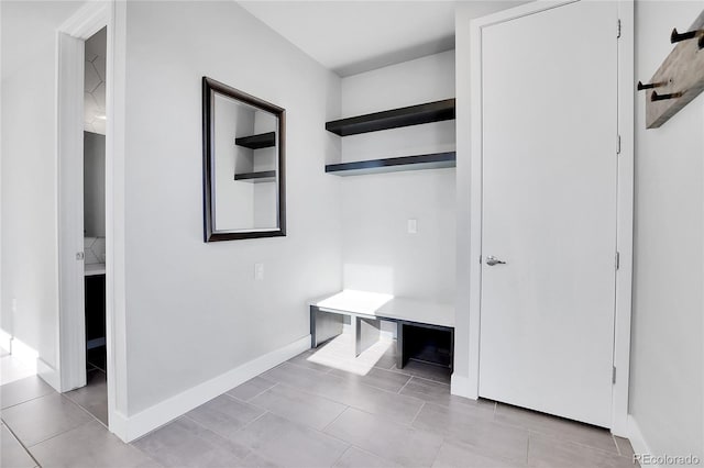 mudroom with light tile patterned flooring