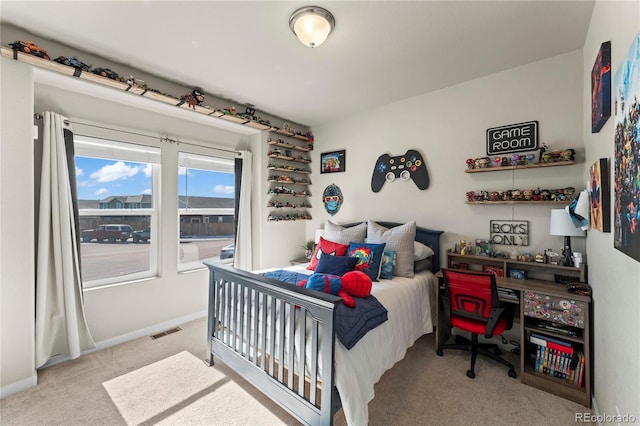 bedroom with baseboards, visible vents, and carpet flooring