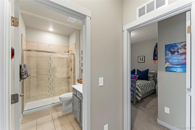 full bath with a stall shower, tile patterned floors, visible vents, and vanity