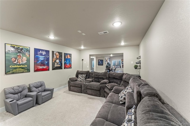 living room featuring carpet, visible vents, and baseboards