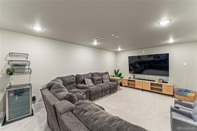 living area featuring recessed lighting, light colored carpet, visible vents, and baseboards