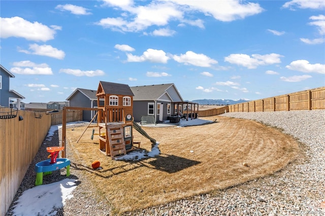 view of playground featuring a fenced backyard