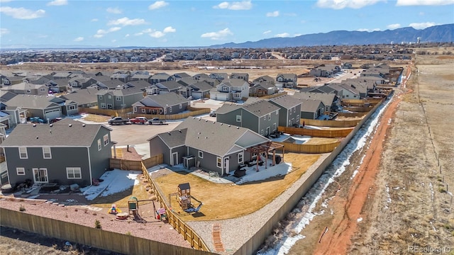 birds eye view of property with a residential view and a mountain view