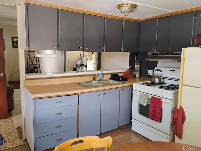 1011 Glen Creighton Dr, Dacono, CO 80514 - kitchen with white appliances, a sink, extractor fan, and light countertops