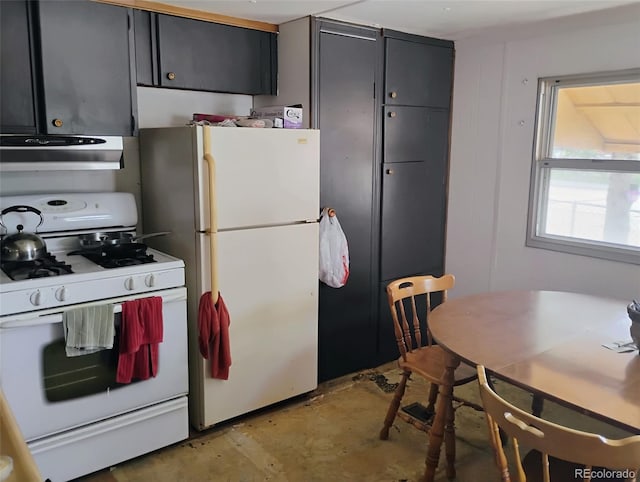 1011 Glen Creighton Dr, Dacono, CO 80514 - kitchen with white appliances, extractor fan, and dark cabinetry