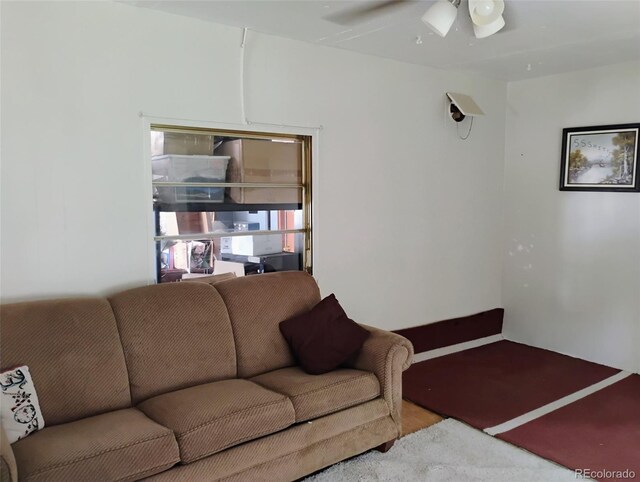 1011 Glen Creighton Dr, Dacono, CO 80514 - living area with ceiling fan and wood finished floors
