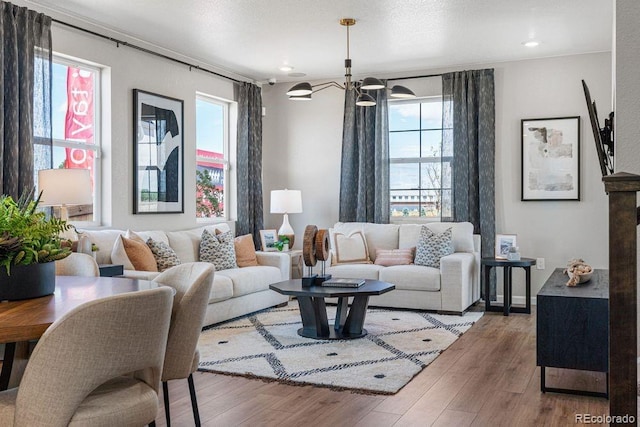 2118 Wagon Wheel Aly, Brighton, CO 80601 - living room featuring healthy amount of natural light, wood finished floors, and recessed lighting