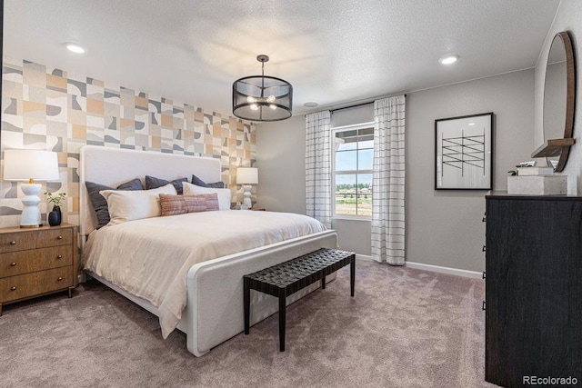 2118 Wagon Wheel Aly, Brighton, CO 80601 - carpeted bedroom featuring a chandelier and recessed lighting
