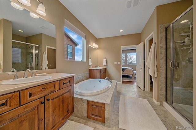 bathroom with ensuite bath, tile patterned floors, a whirlpool tub, vanity, and a shower stall