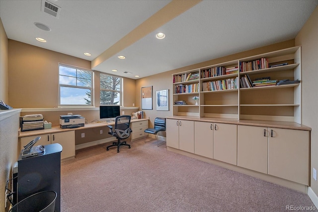 office featuring recessed lighting, visible vents, and light colored carpet