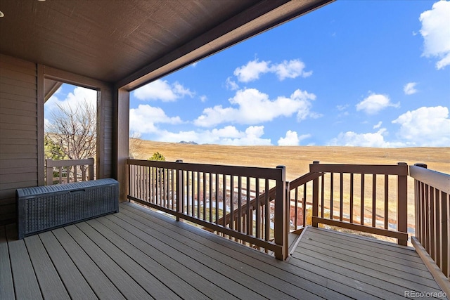 wooden terrace with a rural view