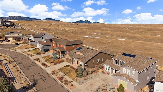 bird's eye view with a residential view and a mountain view