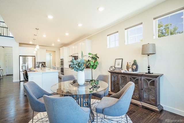 9607 Williamsburg St, Littleton, CO 80125 - dining space featuring dark wood finished floors, plenty of natural light, and recessed lighting