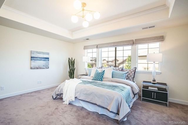 9607 Williamsburg St, Littleton, CO 80125 - carpeted bedroom featuring a tray ceiling, crown molding, and a chandelier