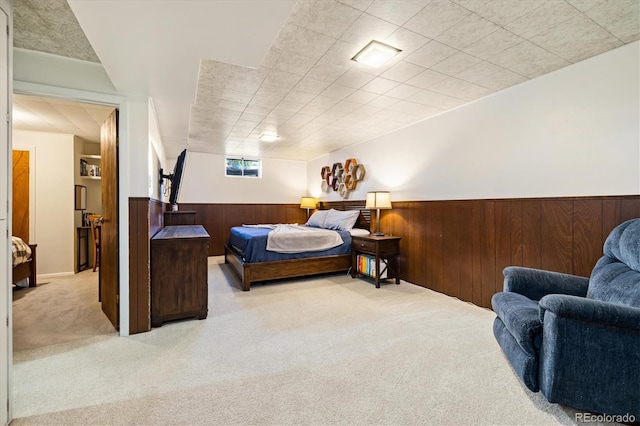 1211 S Zuni St, Denver, CO 80223 - carpeted bedroom with a wainscoted wall and wood walls