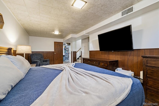 1211 S Zuni St, Denver, CO 80223 - bedroom with a wainscoted wall and wood walls
