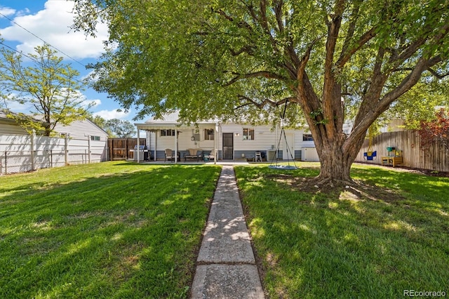 1211 S Zuni St, Denver, CO 80223 - rear view of property with a patio area