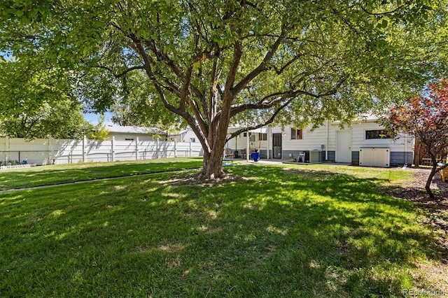 1211 S Zuni St, Denver, CO 80223 - view of yard featuring central air condition unit and a patio