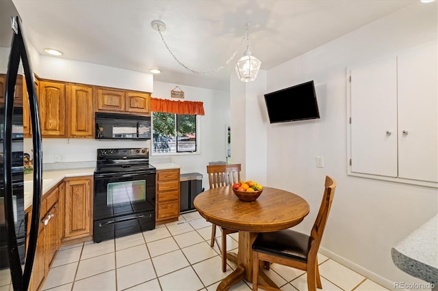 1211 S Zuni St, Denver, CO 80223 - kitchen featuring black appliances, light countertops, brown cabinets, light tile patterned flooring, and recessed lighting