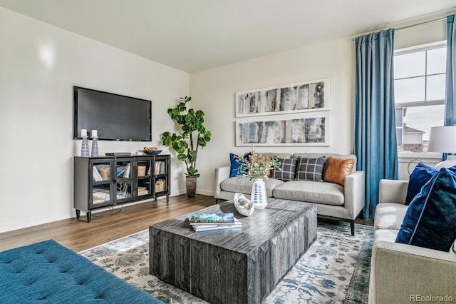 27756 E Byers Pl, Aurora, CO 80018 - living area featuring wood finished floors and baseboards