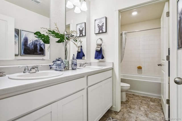 27756 E Byers Pl, Aurora, CO 80018 - bathroom with toilet, double vanity, and shower / tub combo with curtain