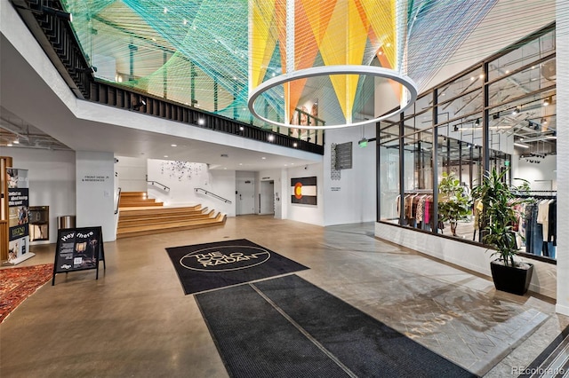 1750 Wewatta St Unit 605, Denver, CO 80202 - community lobby featuring a high ceiling and stairway