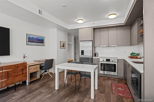 1750 Wewatta St Unit 605, Denver, CO 80202 - kitchen with stainless steel appliances, gray cabinets, dark wood-style flooring, light countertops, and open shelves