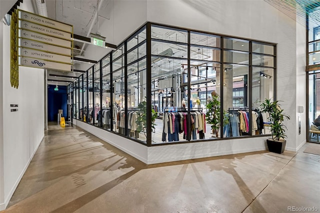 1750 Wewatta St Unit 605, Denver, CO 80202 - corridor with a towering ceiling, concrete floors, and baseboards