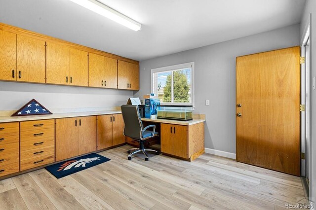 1903 Northmoor Ter, Pueblo, CO 81008 - home office featuring light wood-style flooring and built in study area