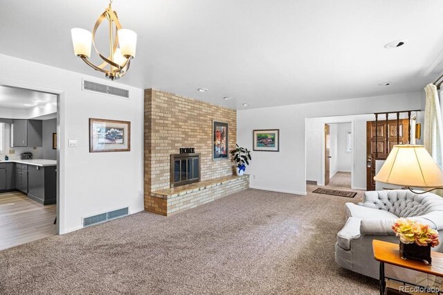 1903 Northmoor Ter, Pueblo, CO 81008 - living area featuring light colored carpet, baseboards, a fireplace, and recessed lighting