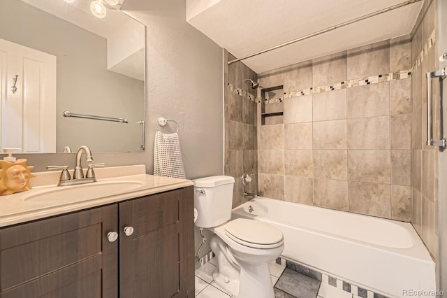 bathroom with toilet, tile patterned flooring, vanity, and tub / shower combination