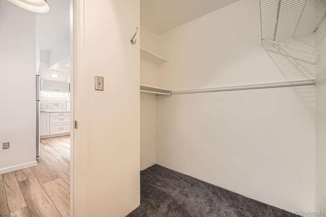 spacious closet featuring light wood-type flooring