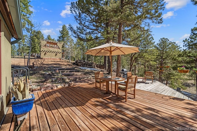 174 Needle Creek Rd, Divide, CO 80814 - wooden terrace featuring grilling area and outdoor dining space