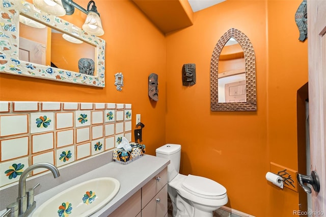 174 Needle Creek Rd, Divide, CO 80814 - bathroom featuring toilet, vanity, and backsplash