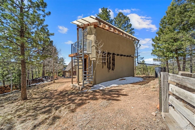174 Needle Creek Rd, Divide, CO 80814 - view of side of property featuring stairs and stucco siding