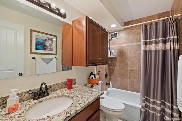 full bathroom with shower / bath combination with curtain, toilet, and vanity