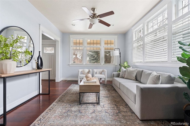 interior space featuring ceiling fan and a wealth of natural light