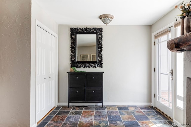 377 Pearl St Unit 5, Boulder, CO 80302 - unfurnished bedroom with dark stone finish floors and a textured wall