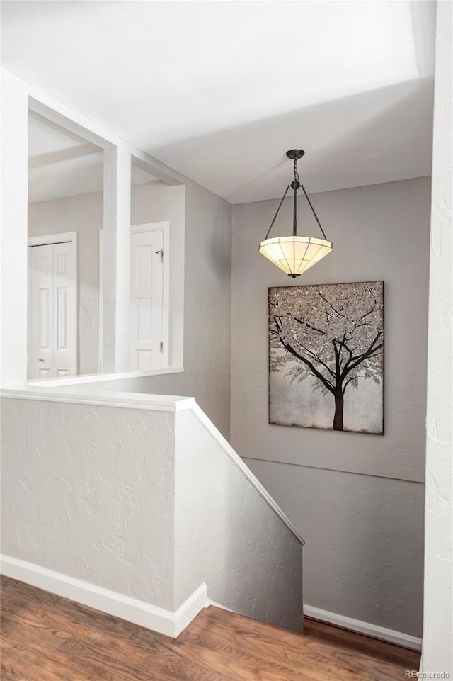 377 Pearl St Unit 5, Boulder, CO 80302 - staircase featuring wood finished floors and baseboards