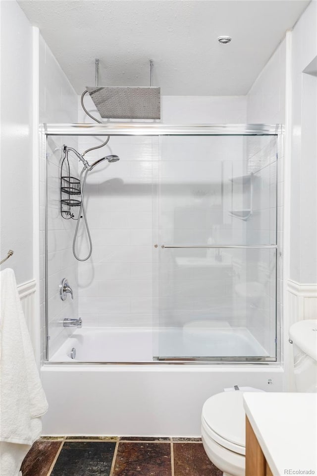 377 Pearl St Unit 5, Boulder, CO 80302 - bathroom featuring vanity, a combined bath / shower with rainfall shower, and a wainscoted wall