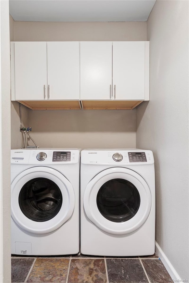 377 Pearl St Unit 5, Boulder, CO 80302 - laundry room featuring cabinet space, separate washer and dryer, and stone finish floors