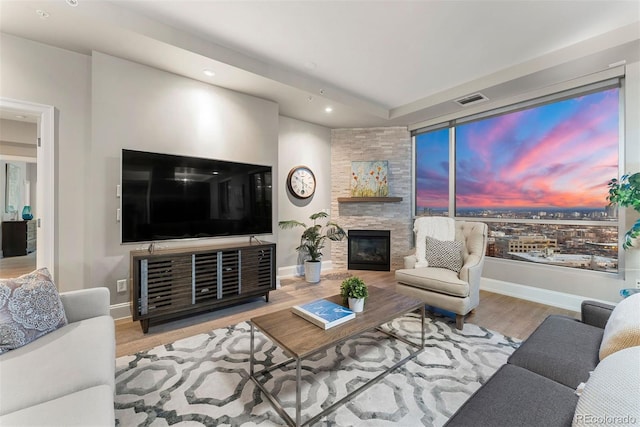 2001 Lincoln St Unit 2524, Denver, CO 80202 - living area featuring a fireplace, wood finished floors, baseboards, and recessed lighting