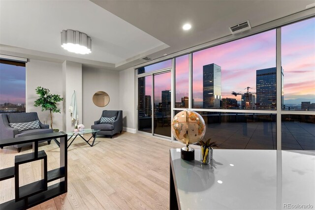 2001 Lincoln St Unit 2524, Denver, CO 80202 - sitting room with a view of city, wood finished floors, baseboards, recessed lighting, and floor to ceiling windows