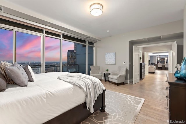 2001 Lincoln St Unit 2524, Denver, CO 80202 - bedroom with wood finished floors and baseboards
