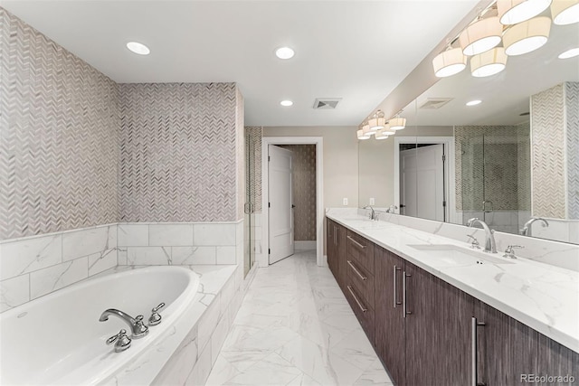 2001 Lincoln St Unit 2524, Denver, CO 80202 - full bathroom featuring marble finish flooring, a bath, a stall shower, double vanity, and recessed lighting