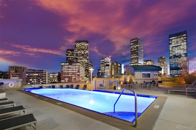 2001 Lincoln St Unit 2524, Denver, CO 80202 - pool at dusk with a view of city, a community pool, and a patio