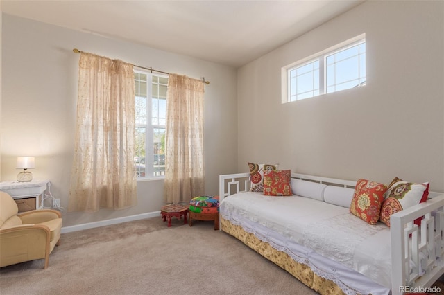 bedroom with carpet and baseboards