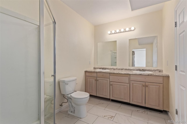 bathroom with toilet, marble finish floor, double vanity, and a stall shower