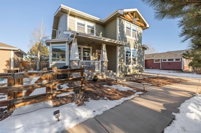 view of front of property with a garage and covered porch